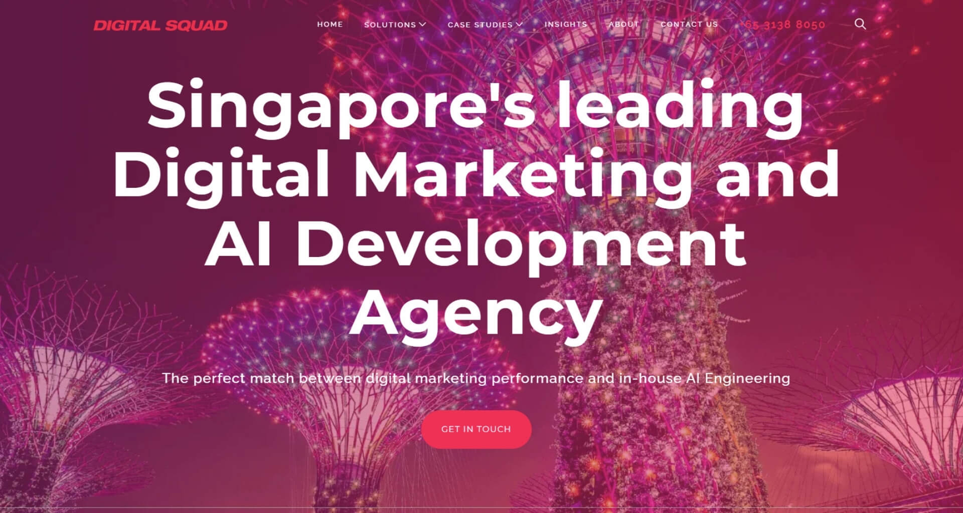 Digital Squad homepage banner featuring Singapore's Gardens by the Bay Supertrees lit up in pink and purple. The main headline is