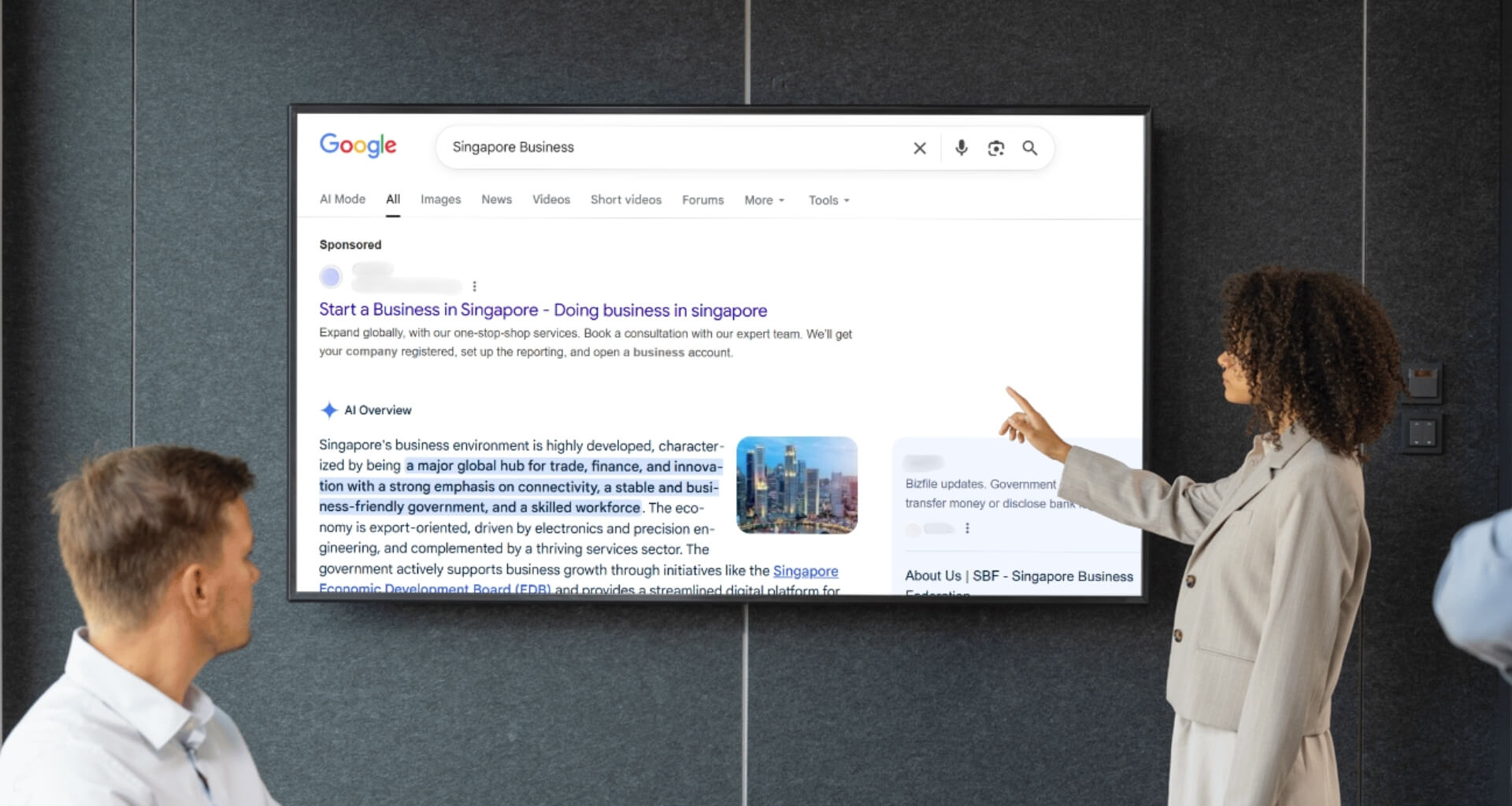 SEO consulting meeting in Singapore, showing marketing specialists analyzing competitive Google search results and strategy for 2025.